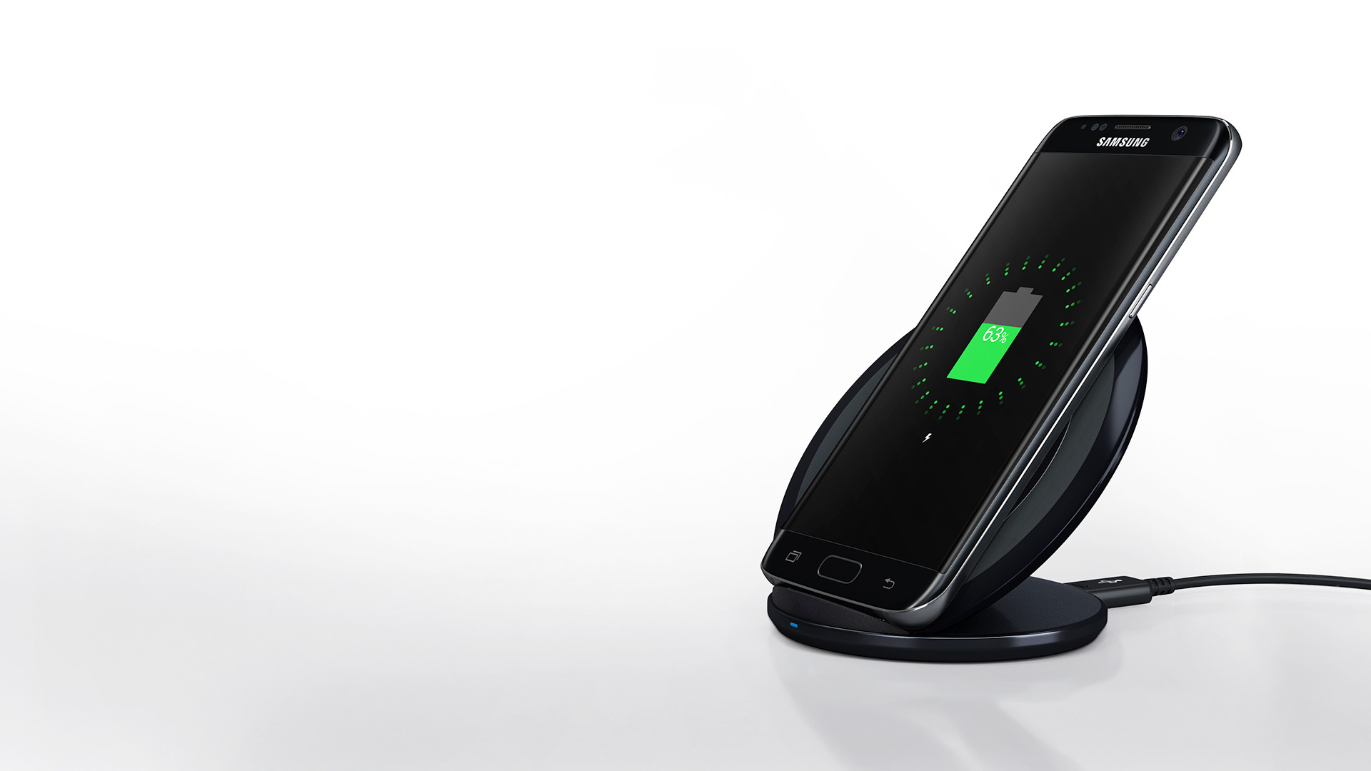 An image showing a Galaxy S7 edge device recharging on a wireless charger.