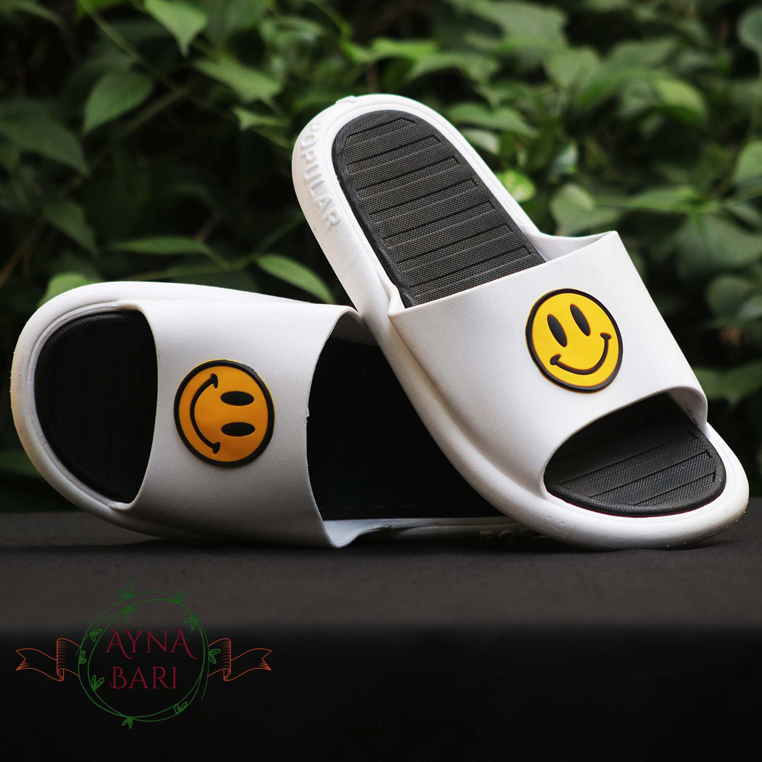 nike slides with smiley face