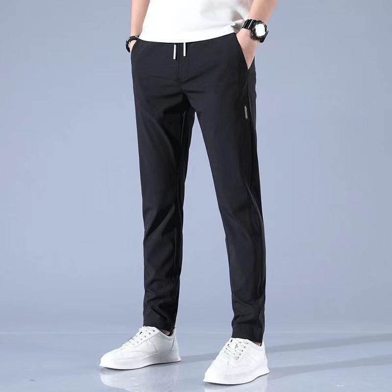 Xia Xiu thin ice silk casual pants men's work trend loose straight breathable sports cropped pants men. 