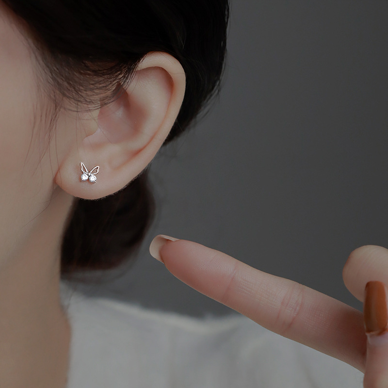 Butterfly Stud Earrings Women's New Niche Design Earrings in Autumn and Winter Simple Temperament Hollow Diamond Small Butterfly Earrings. 
