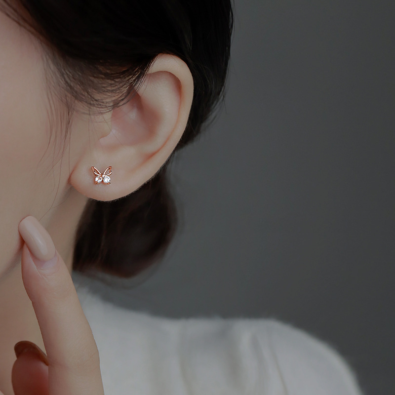 Butterfly Stud Earrings Women's New Niche Design Earrings in Autumn and Winter Simple Temperament Hollow Diamond Small Butterfly Earrings. 