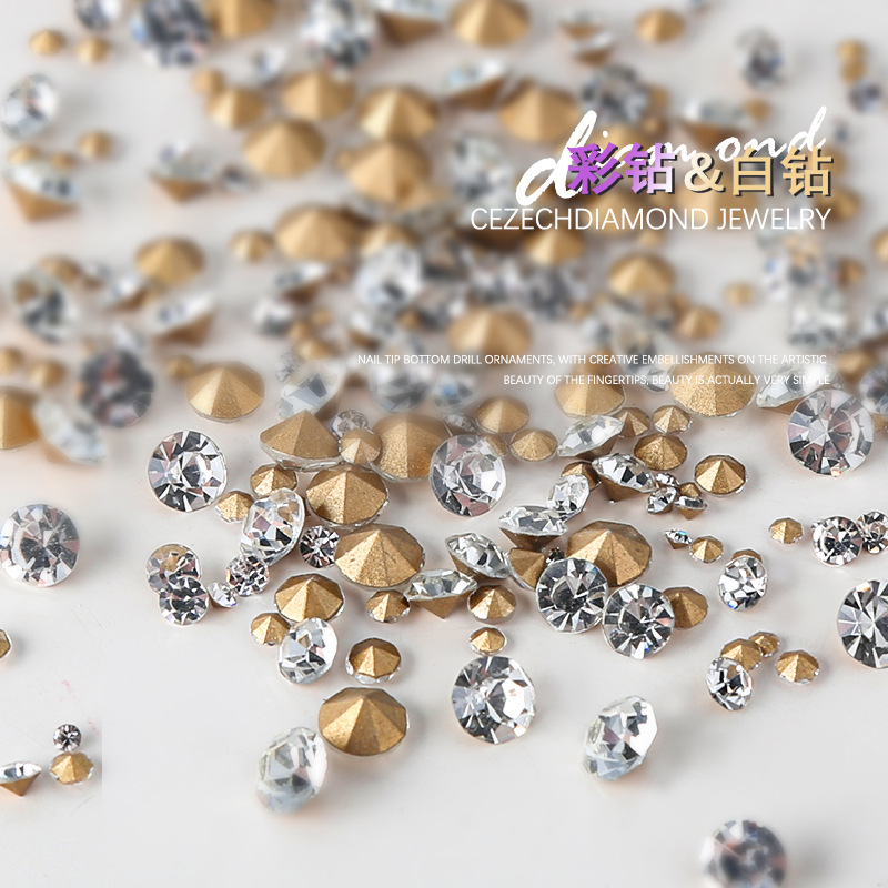 Nail jewelry, white diamonds on gold background, AB colored diamonds, culets, 6 compartments, boxed mixed size, size nails, pointed diamonds. 