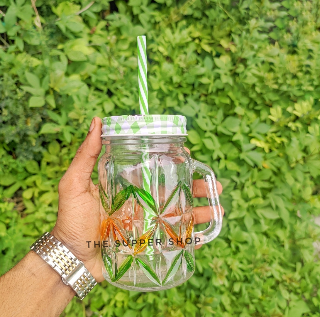Mason Jar Mugs with Handle, multicolored Lids and Plastic Straws. 