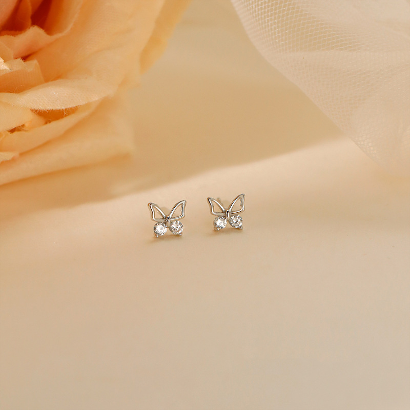 Butterfly Stud Earrings Women's New Niche Design Earrings in Autumn and Winter Simple Temperament Hollow Diamond Small Butterfly Earrings. 