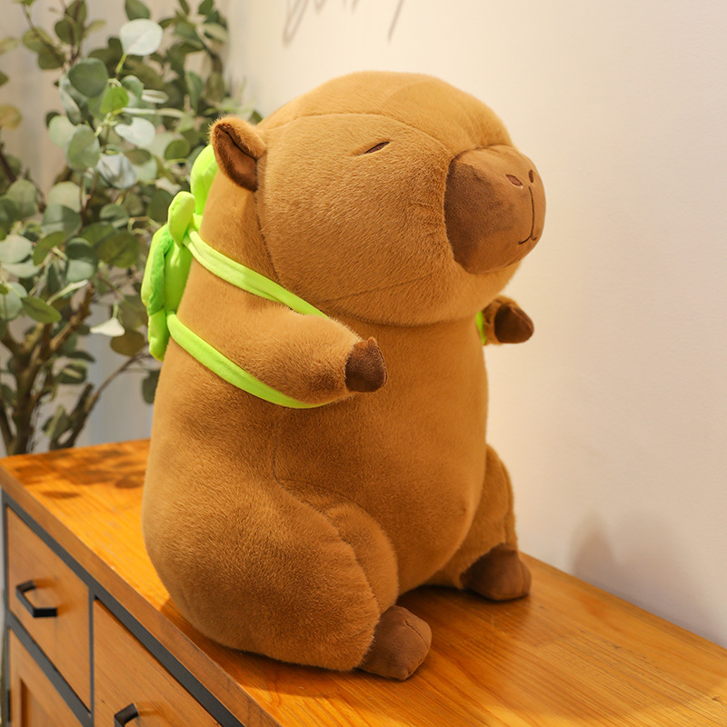 Factory direct supply of capibala plush toys runny nose strawberry hat turtle backpack capybara doll doll wholesale