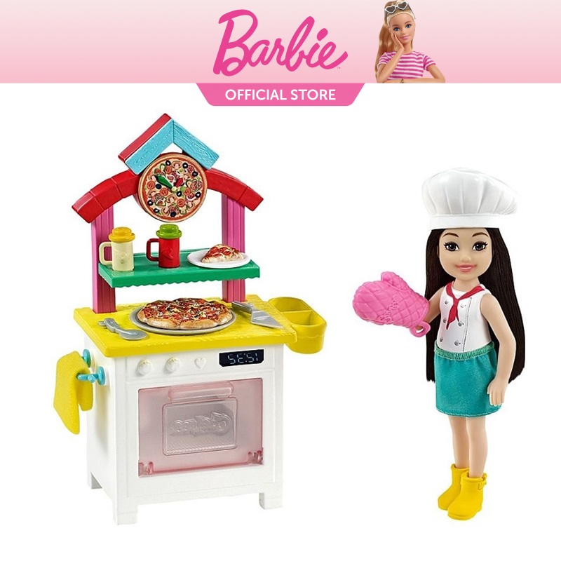 Barbie GTN63​ Chelsea Can Be Pizza Chef Playset with Brunette Chelsea Doll (6-in/15.24-cm), Pizza Oven, 2 Spice Shakers, Pizza Pan & More. 