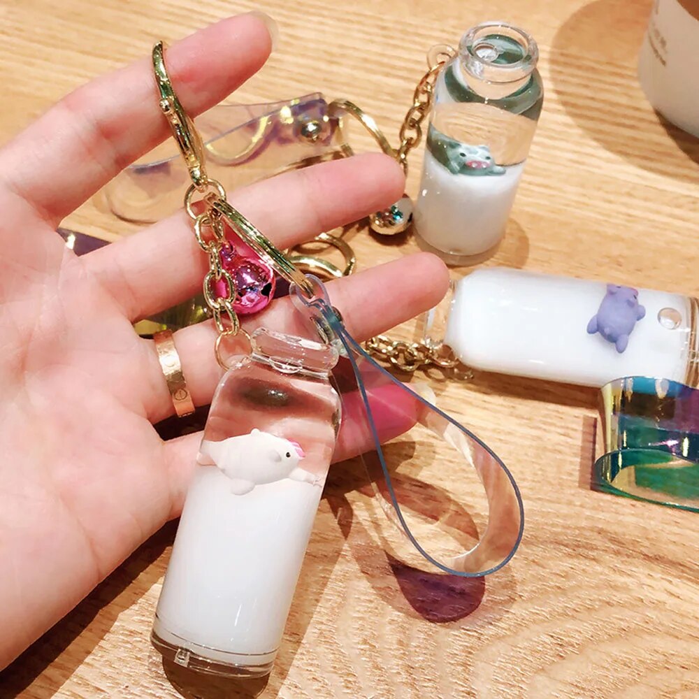 【3C VictoryEagle】Creative Cute Milk Bottle Keychain Moving Liquid Quicksand Drift Bottle Keyring For Pendant Toy. 