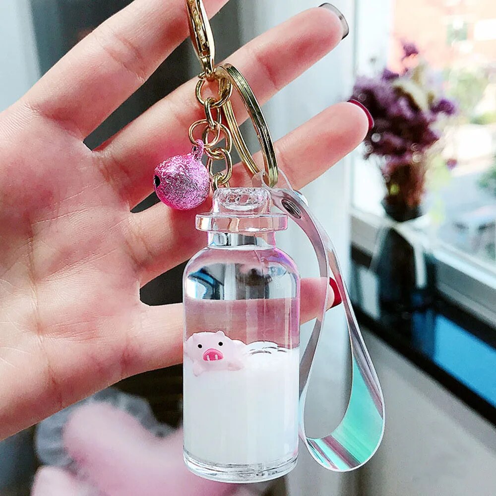 【3C VictoryEagle】Creative Cute Milk Bottle Keychain Moving Liquid Quicksand Drift Bottle Keyring For Pendant Toy. 