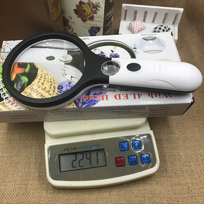 Jinghui manufacturers creative four LED light racket double light lens reading handheld 108mm magnifying glass 70108AB. 