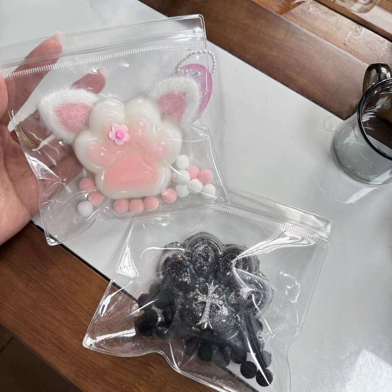 The same ultra soft pinching and plush cat paw simulation mud animal footprint decompression toy. 