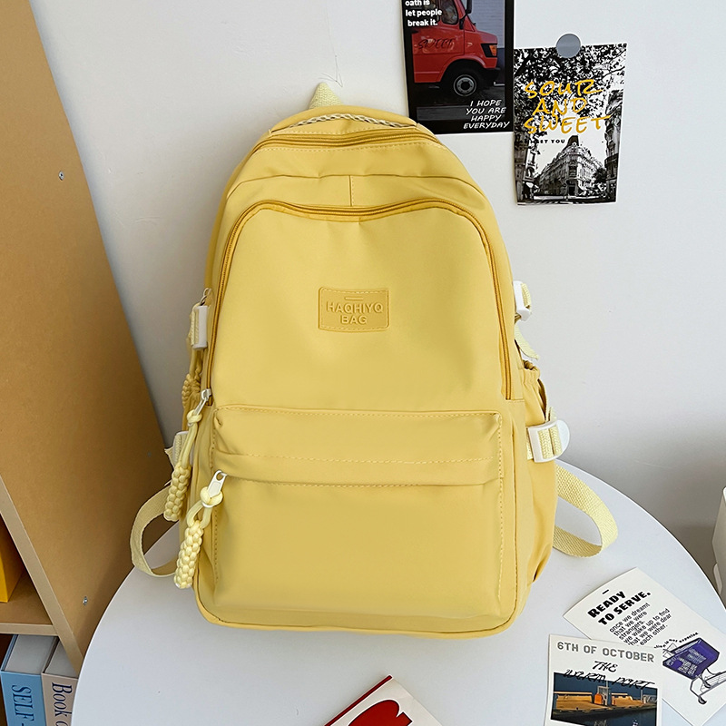 College student school bag cream solid color Japanese college style ins girl backpack high school student simple and versatile backpack. 