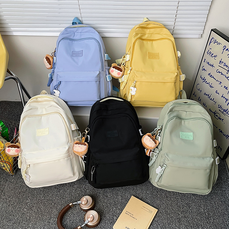 College student school bag cream solid color Japanese college style ins girl backpack high school student simple and versatile backpack. 