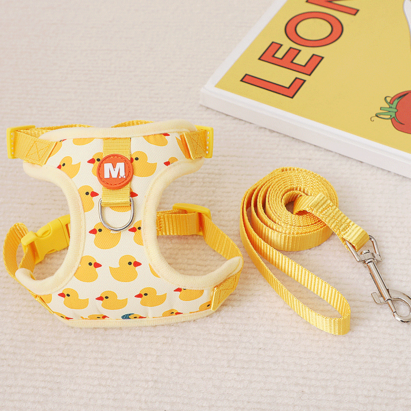 There are only 4 steps to put on the pet harness. Very easy to wear. Simply open the harness, slide your pet's front legs through the harness, then close and buckle it again, attach the harness with the double rings, and you're done!. 