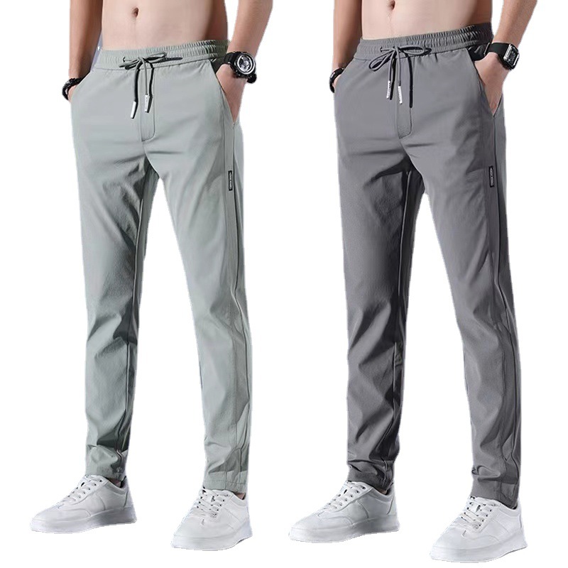Xia Xiu thin ice silk casual pants men's work trend loose straight breathable sports cropped pants men. 