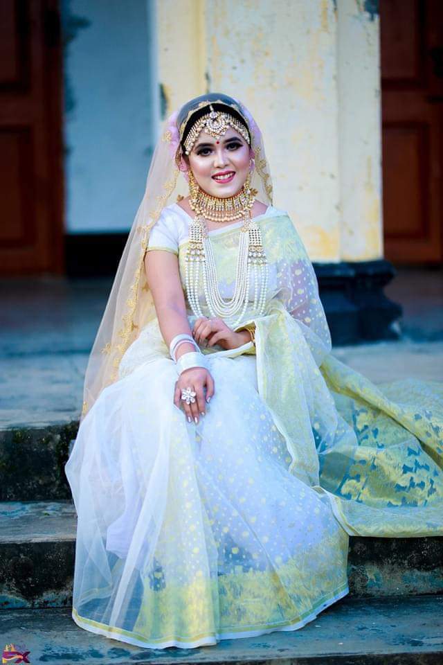 white jamdani bride