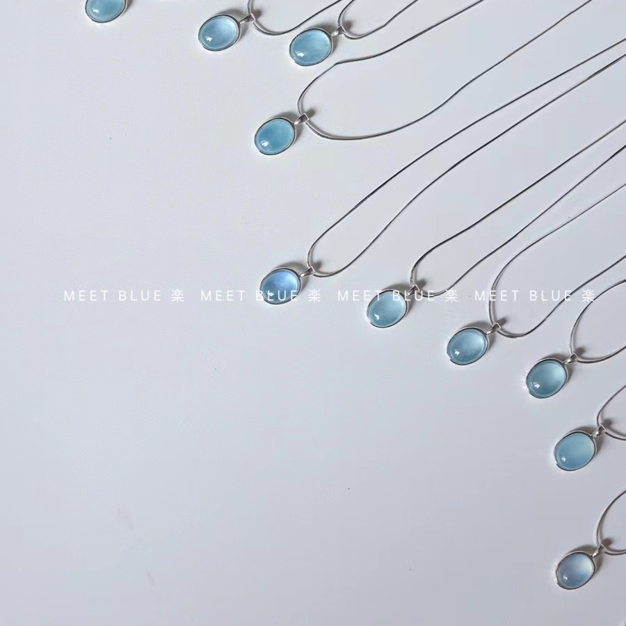 Aquamarine egg-shaped crystal necklace ins niche simple oval water drop pendant temperament versatile light luxury snake bone chain. 