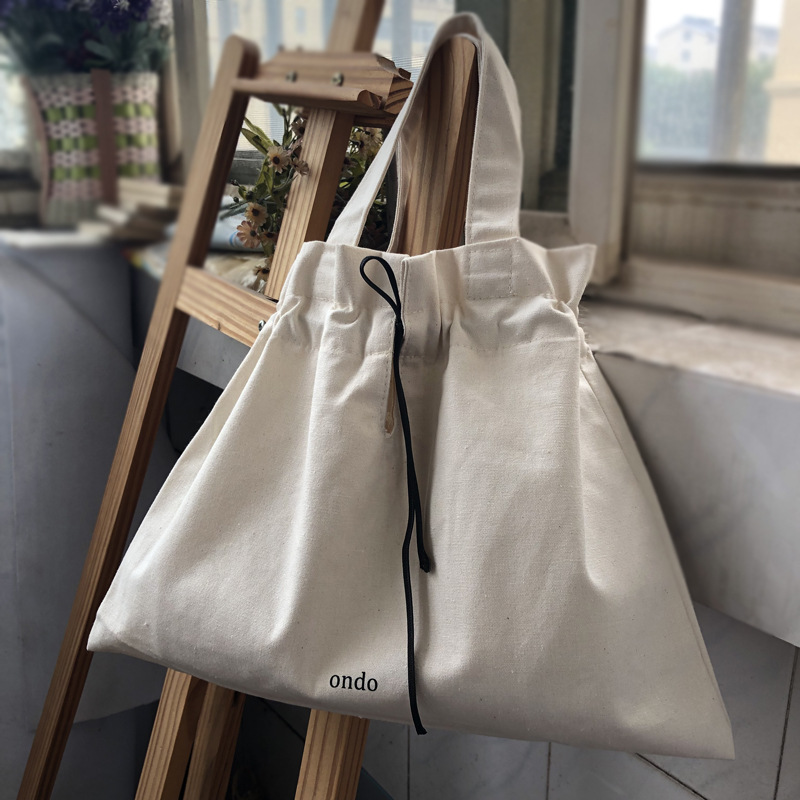 ins Japanese small hand carrying canvas bag Korean version drawstring carrying small bag casual and versatile coin purse mini small bag