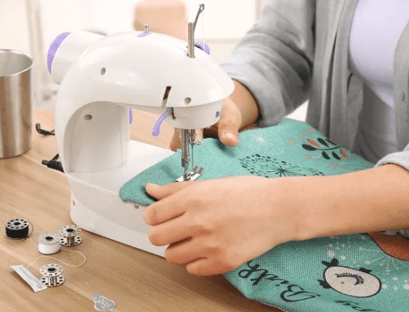 8 in 1 Mini Sewing Machine - Dual Speed Portable Mini Electric Pedal Double Threads Rewind Swing Machine. 