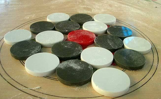Carrom Coin Set with Striker. 