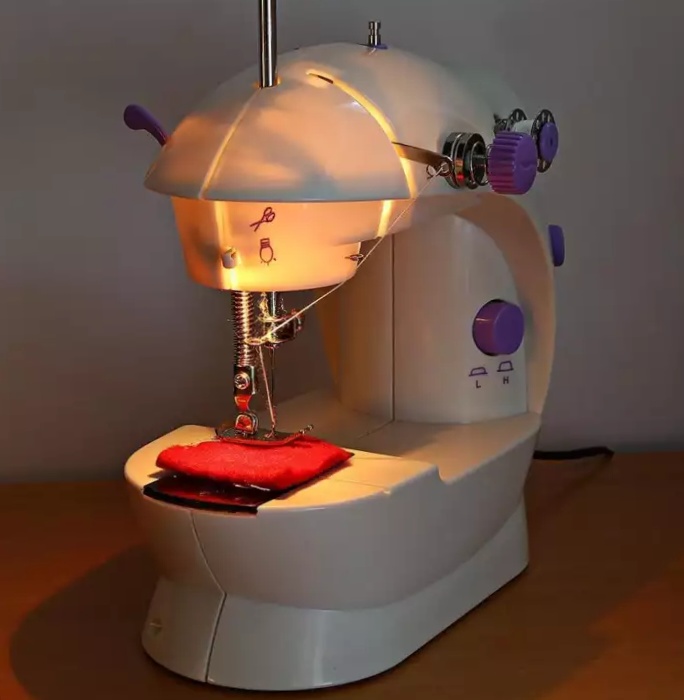 8 in 1 Mini Sewing Machine - Dual Speed Portable Mini Electric Pedal Double Threads Rewind Swing Machine. 