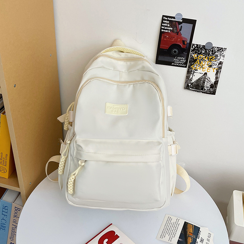 College student school bag cream solid color Japanese college style ins girl backpack high school student simple and versatile backpack. 