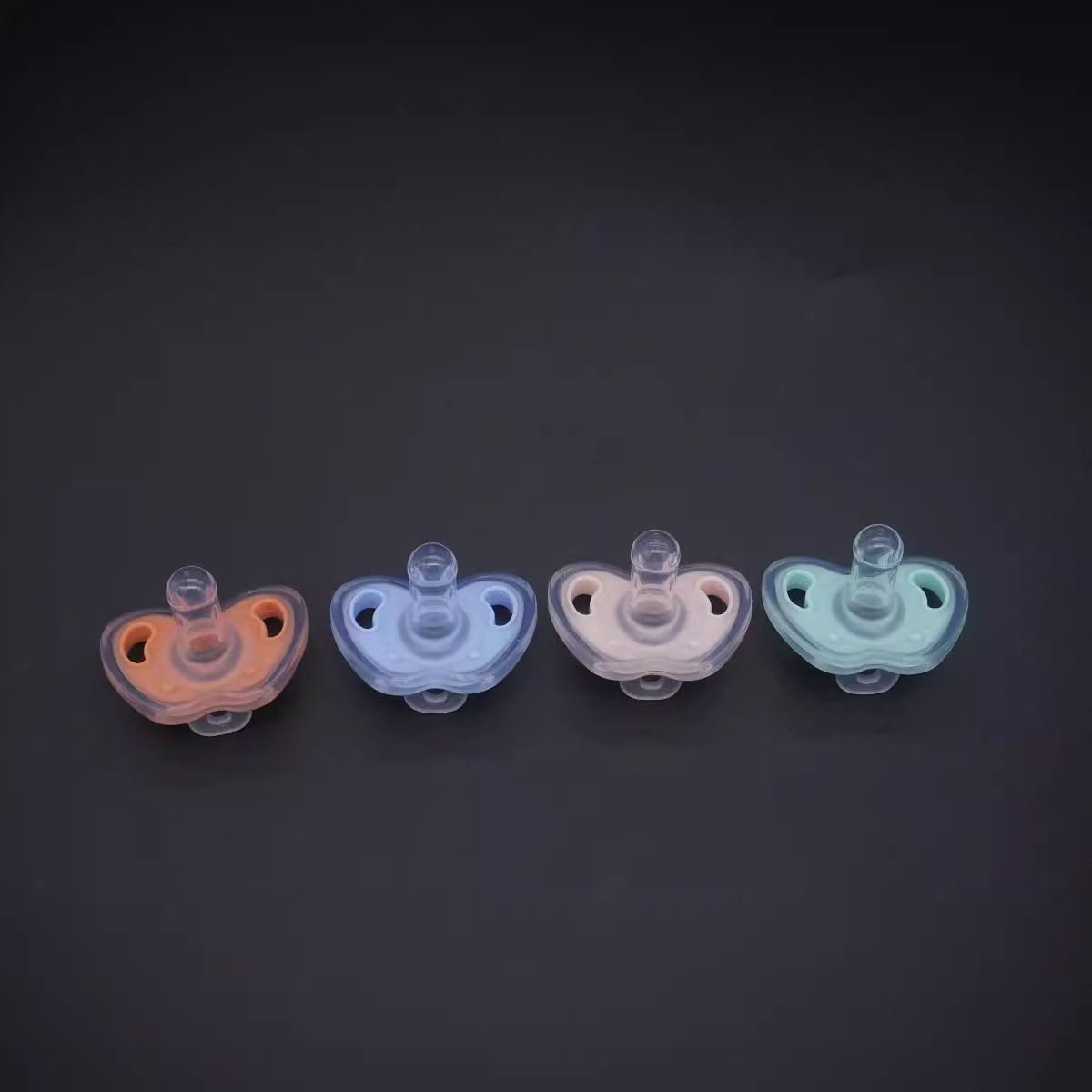Baby two-color ultra-soft silicone pacifier with round head flat head strap chain and storage box. 